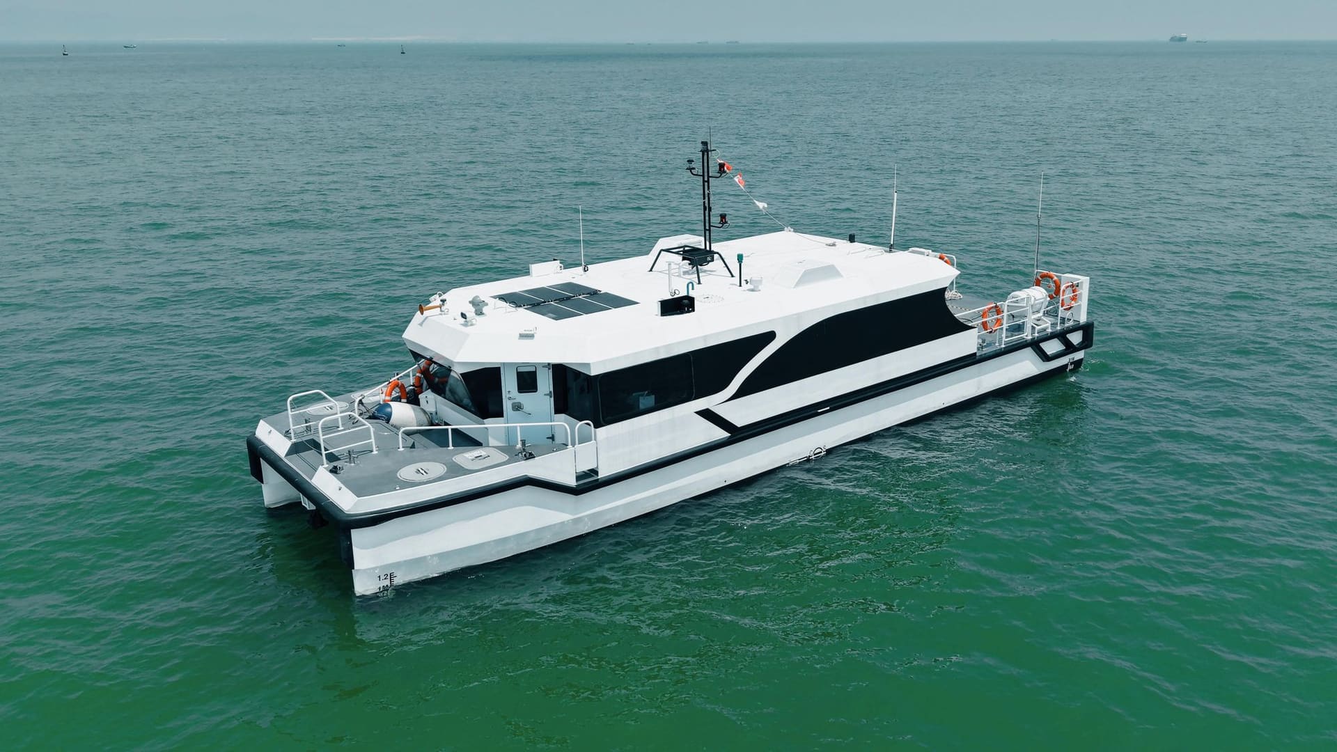 OBLUE E60 electric catamaran at anchor