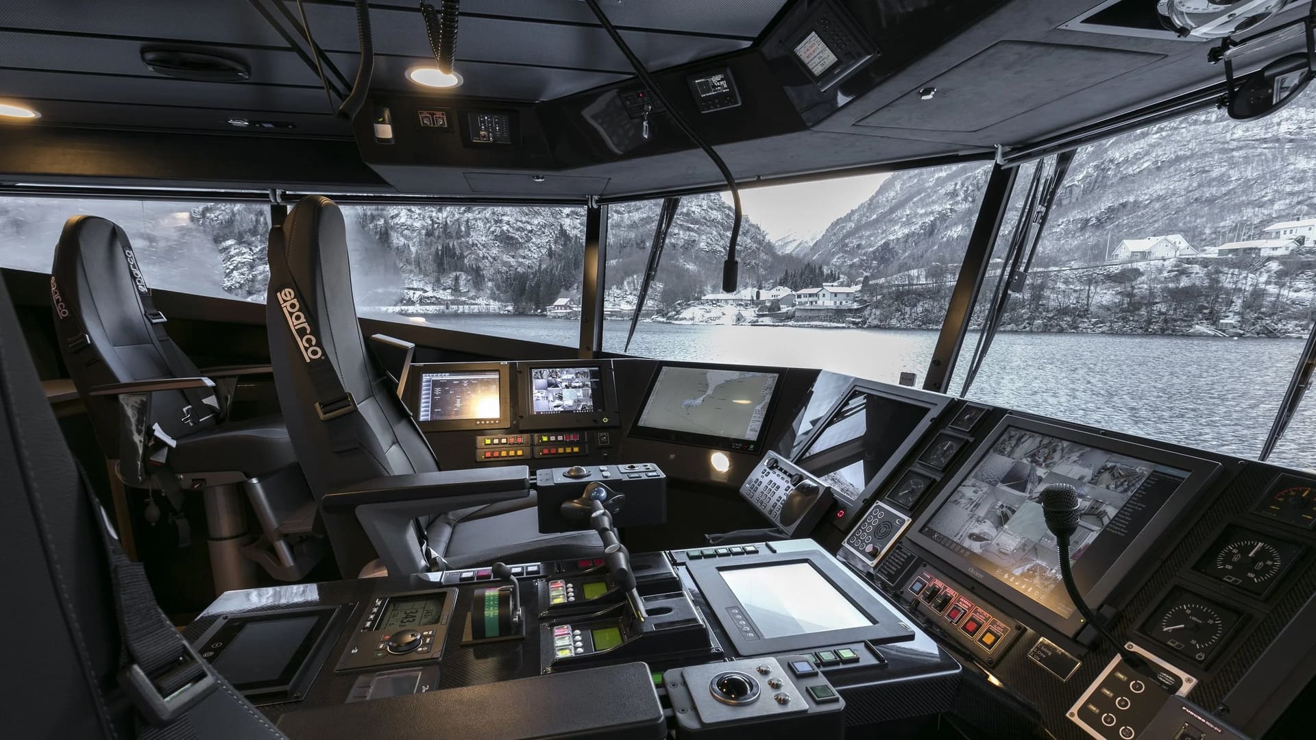 Wheelhouse of the OBLUE FERRY 26 with panoramic fjord view and navigation consoles