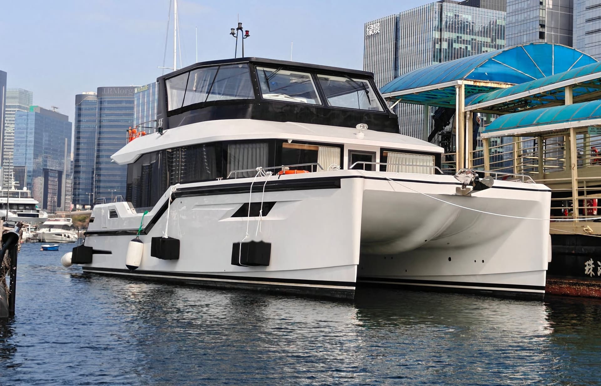 OBLUE carbon fiber catamaran bows at the dock