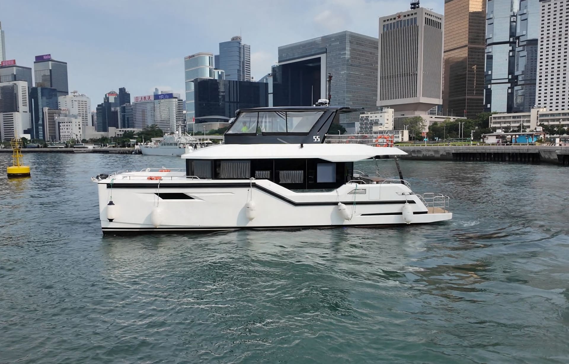 OBLUE 55 luxury carbon fiber catamaran underway in Victoria Harbour