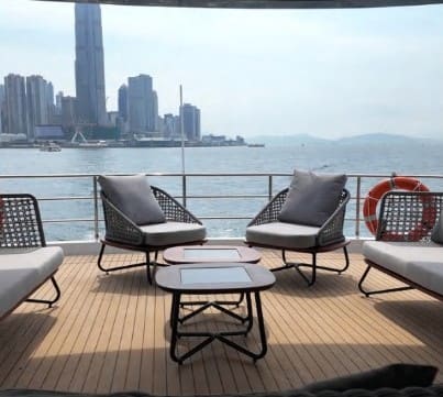 Aft-deck terrace of the OBLUE 55 overlooking Victoria Harbour
