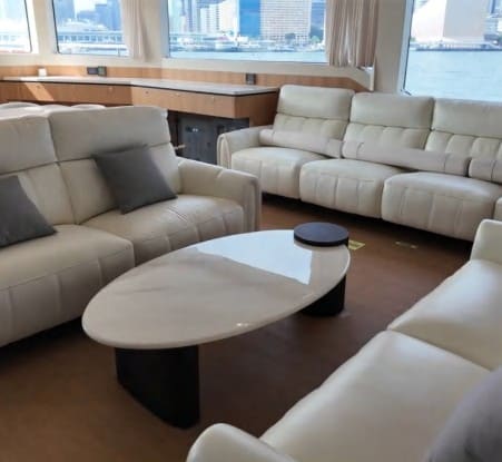 Main-deck salon with leather sofas on board the OBLUE 55